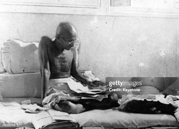 Indian statesman Mahatma Gandhi fasts in protest against British rule after his release from prison in Poona, India.