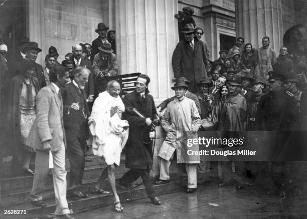 Mahatma Gandhi , Indian Congress Leader and representative of the Indian Nationals, leaves the Friends' Meeting House, Euston Road, after attending...