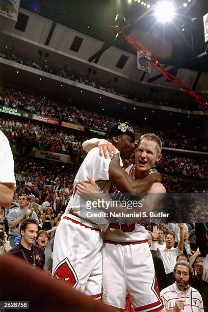 Steve Kerr and Michael Jordan of the Chicago Bulls celebrate after defeating the Utah Jazz to win the NBA Championship at the United Center circa...