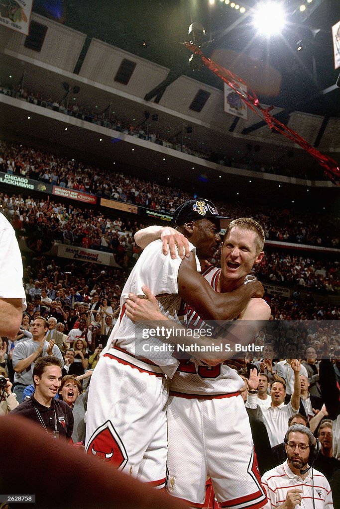 Steve Kerr celebrates with Michael Jordan