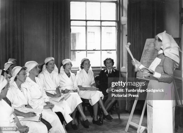 Edwina Mountbatten nee Ashley, the Countess of Mountbatten, the wife of Louis, whom she married in 1922. Here she is sitting in on a lecture with...