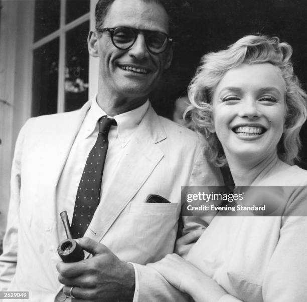 American film star Marilyn Monroe outside her home in Englefield Green with her third husband American playwright Arthur Miller. Original...