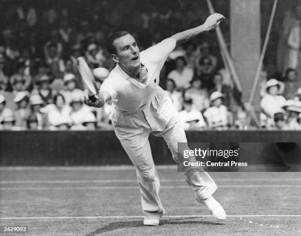 English tennis player Fred Perry in action against Roderick Menzel of Czechoslovakia during the championship at Wimbledon. He was three times...