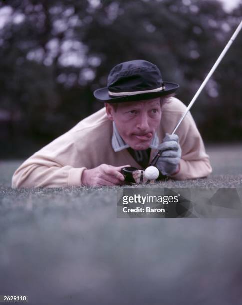 American film, stage and television actor Danny Kaye lining up a shot on the golf course. Original Publication: People Disc - HN0560