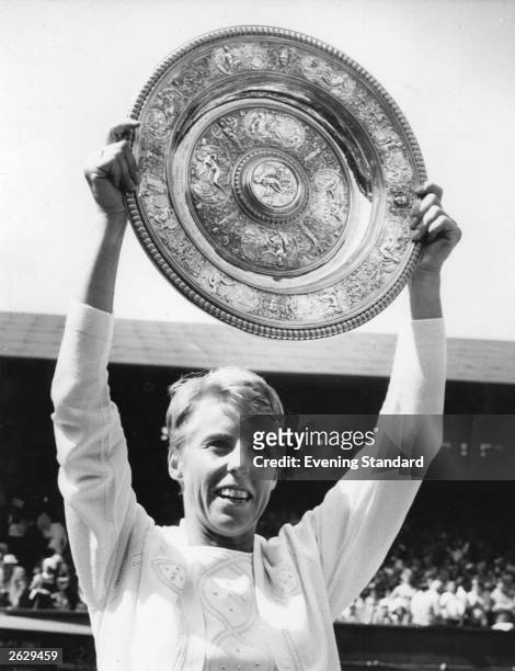 British tennis player Ann Jones holds the Women's Singles trophy at Wimbledon tennis championships, after her victory over Billie-Jean King. Original...
