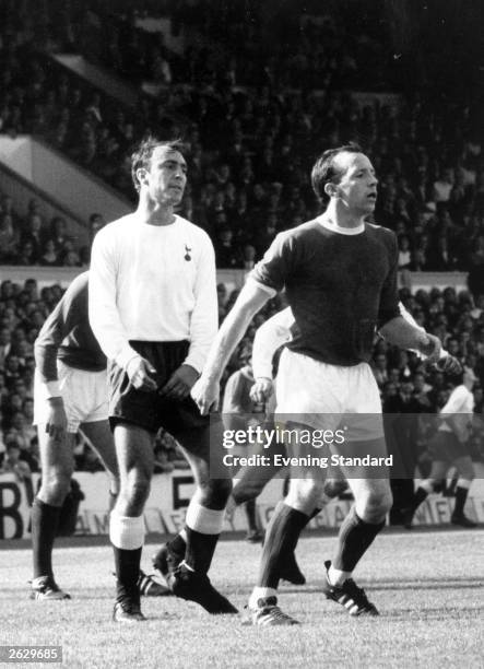 Manchester United player Nobby Stiles with Jimmy Greaves of Tottenham Hotspur. Original Publication: People Disc - HU0316