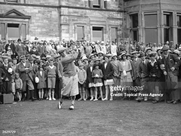 American golfer Bobby Jones drives off from the first tee during a practice game on the Old Course at St Andrews, where the British Open Golf...
