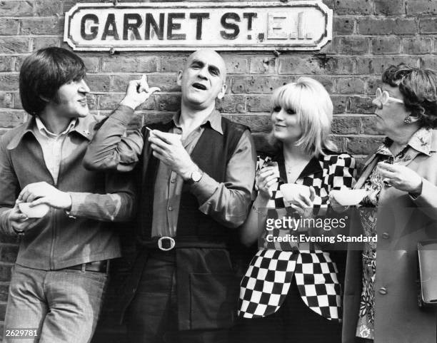 English actor Warren Mitchell with Adrienne Posta and Dandy Nichols in Garnet Street in East London. Original Publication: People Disc - HN0235