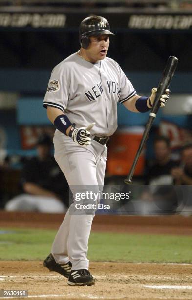 Karim Garcia of the New York Yankees reacts after striking out in the second inning during game four of the Major League Baseball World Series...