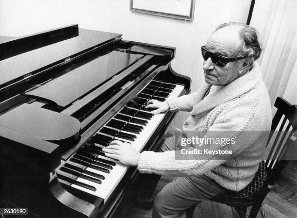 Blind Spanish composer Joaquin Rodrigo playing the piano at his home in Madrid.