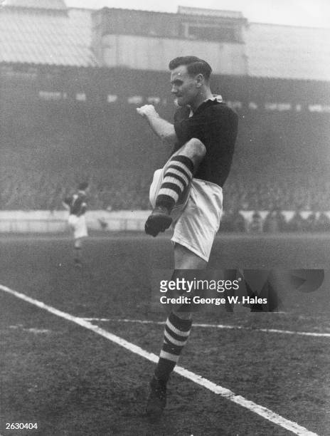 Manchester City centre-forward Don Revie kicking the ball at Stamford Bridge during a match against Chelsea. Original Publication: Picture Post -...