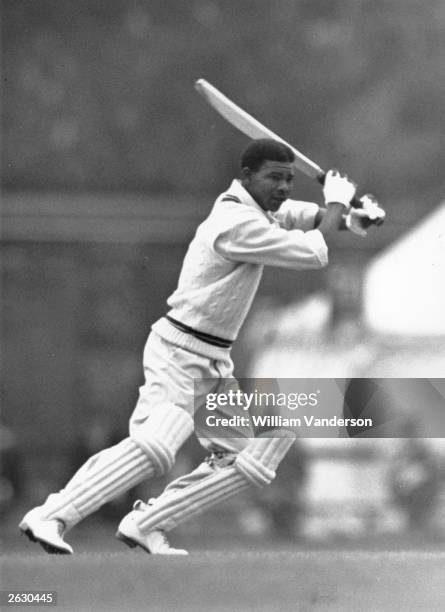 West Indies cricketer Everton Weekes in action batting against Cambridge University. Original Publication: Picture Post - 5056 - Fine Weather...