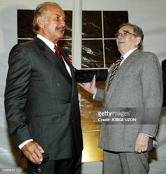 Mexican writer Carlos Fuentes talks with Nobel Prize for Literature winner Colombian Gabriel Garcia Marquez, after having been decorated by French...