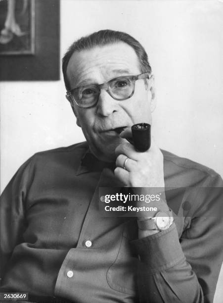 Georges Joseph Christian Simenon , the Belgian born French novelist, remembered for his novels featuring Jules Maigret, the pipe smoking, persistent...