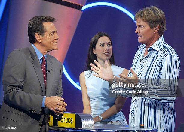 Olympic Athletes Bruce Jenner and Janet Evans talk with the host of Lingo Chuck Woolery on the set October 22, 2003 in Los Angeles California.