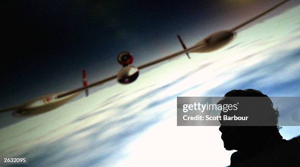 Sir Richard Branson, chairman of Virgin Atlantic, looks on as an image of the aircraft he will use in his latest record attempt with pilot Steve...