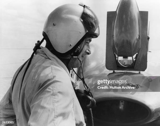 Donald Campbell , British car and speedboat racer, deep in thought at Lake Eyre, Australia, where he will try and break the land speed record....