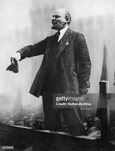 Vladimir Ilyich Lenin , the Russian Dictator standing and addressing a crowd.