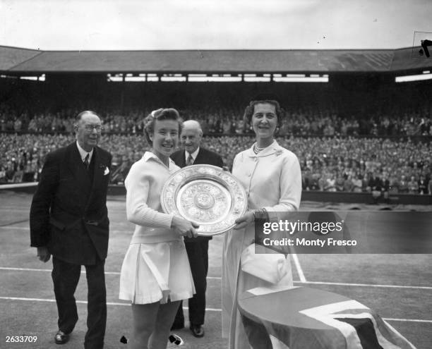 American tennis champion Maureen Connolly is presented with the Ladies Singles Championship Shield at Wimbledon by the Duchess of Kent.