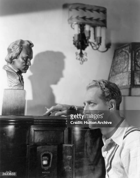 American actor, pianist and composer, Otto Kruger in the music room of his new Beverly Hills home.