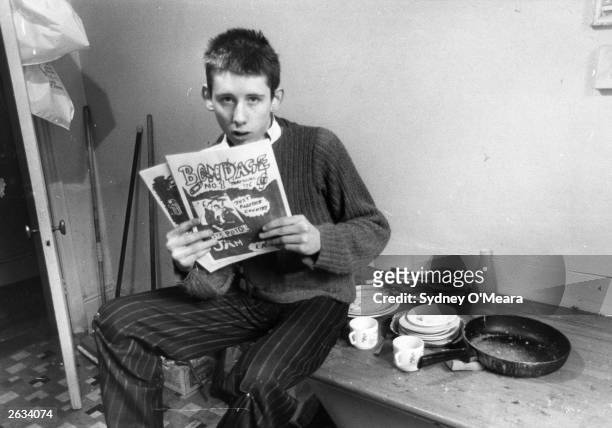 Year-old Shane MacGowan, editor of punk rock magazine 'Bondage' in his office at St Andrews Chambers, Wells Street, London. He went on to front The...