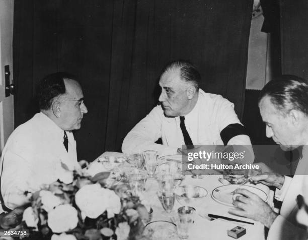 Getulio Dornelles Vargas , the Brazilian rancher, lawyer and dictator-president conferring with American President Franklin Delano Roosevelt at a...