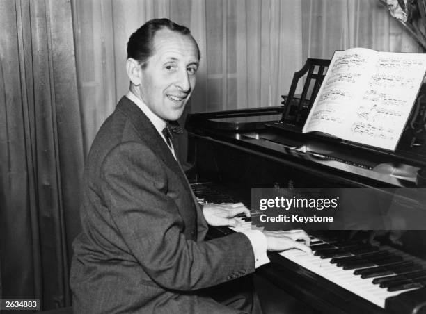 Russian-born American pianist Vladimir Horowitz playing the piano at Claridge's Hotel in London, 21st September 1951.