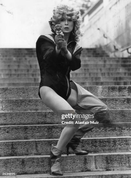 Julie Walters, the actress, pictured blasting her way into the new play 'Flaming Bodies' which is being put on by the ICA Theatre. She is playing the...