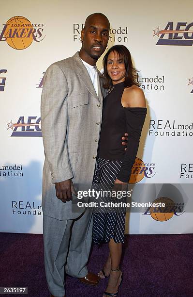 Gary Payton of the Los Angeles Lakers and his wife Monique pose during a Lakers pre-season party hosted by Shaquille O'Neal of the Lakers to benefit...