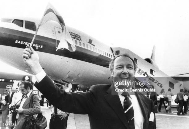 Sir Freddie Laker waving a flag at the launch of the 'Skytrain' no frills, low fare operation. Laker is standing in front of 'Eastern Belle', a Laker...