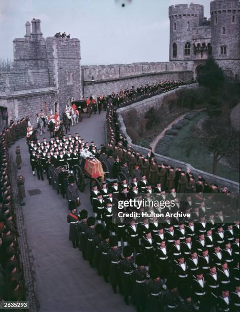 The funeral procession of King George VI arrives at Windsor Castle, Berkshire, 15th February 1952.