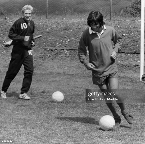 Manchester United footballers George Best and Denis Law in training.