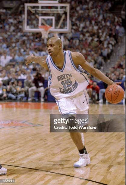 Vince Carter of the North Carolina Tar Heels moves the ball down the court during an NCAA Final Four semi final game against the Utah Utes at the...