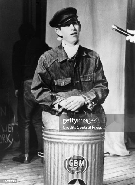 Charles, Prince of Wales rehearsing his part in a sketch called 'Scoop' for the Trinity College Dryden Society revue called 'Revolution', at...