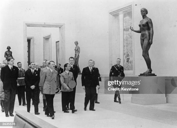 German chancellor Adolf Hitler, , accompanied by Joseph Goebbels, , at the 1938 Nazi Art Exhibition, during the 'Day of German Art' celebrations at...