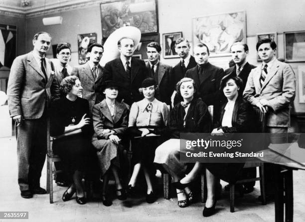 Salvador Dali Spanish Surrealist painter with other artists at the first Surrealist Exhibition to be held in London. Back row, from left, are Rupert...