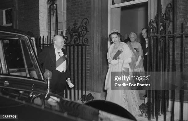 Queen Elizabeth II and Prince Philip leave 10 Downing Street in London after having dinner with Sir Winston Churchill , the British Prime Minister...