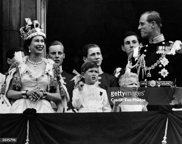 Queen Elizabeth II on the balcony of Buckingham Palace after her Coronation ceremony with ; Prince Charles, Princess Anne and The Prince Philip, Duke...