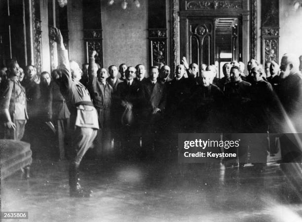 General Franco taking an oath during a ceremony where he is proclaimed Supreme Head of the insurgent 'Nationalist Government'.