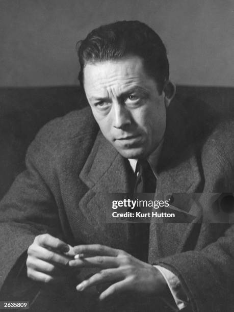 Algerian-born French writer and philosopher Albert Camus during an interview in London. Original Publication: Picture Post - 6297 - Camus: The...