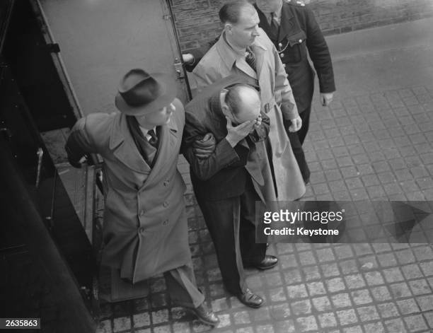 John Christie arriving at court in London to face four charges of murder, 8th April 1953.