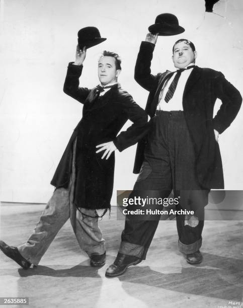 Stan Laurel and Oliver Hardy in a dance routine from the film 'Way Out West', directed by James Horne.