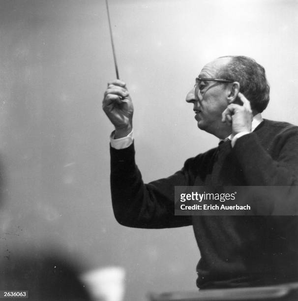 Composer Aaron Copland conducting.