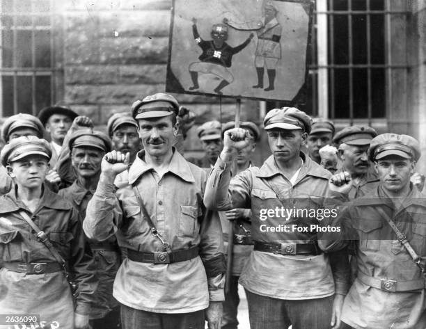 German anti-fascists give the clenched fist salute.