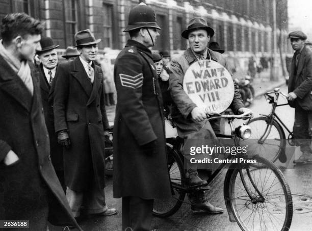 Demonstrator in Downing Street, London, during the abdication crisis. King Edward VIII abdicated on December 11 on account of general disapproval of...