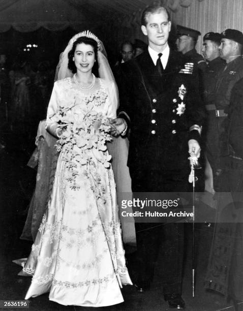 Queen Elizabeth II, as Princess Elizabeth, and her husband the Duke of Edinburgh, styled Prince Philip in 1957, on their wedding day. She became...