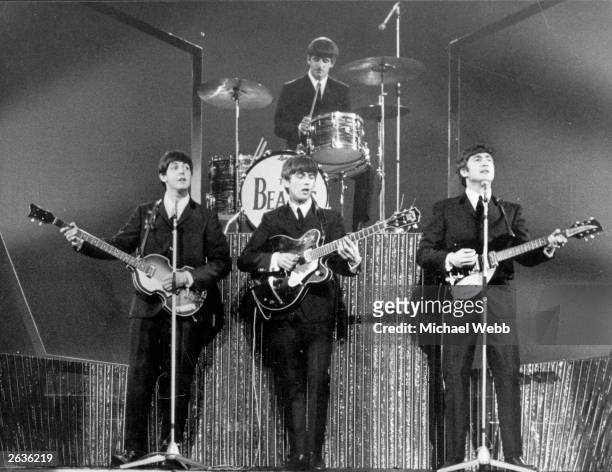The Beatles on stage at the London Palladium during a performance in front of 2, 000 screaming fans.