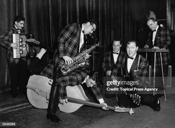 Rock 'n' roll group Bill Haley And His Comets, famous for the song 'Rock Around the Clock', seen here during rehearsals in London for their first...