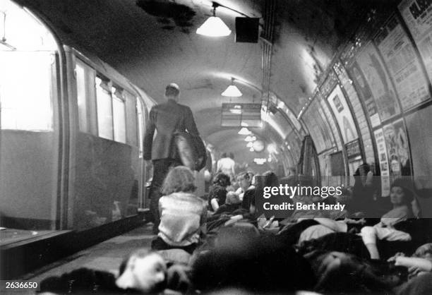 Londoners sheltering in an underground station during an air raid. Original Publication: Picture Post - 319 - And This Is A London Tube Station -...