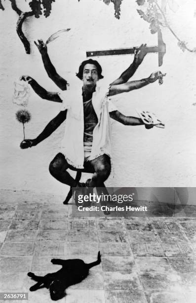 Spanish artist Salvador Dali, , one of the principal figures of the Surrealist Movement, in a multiple exposure pose at his home in Cadaques on the...